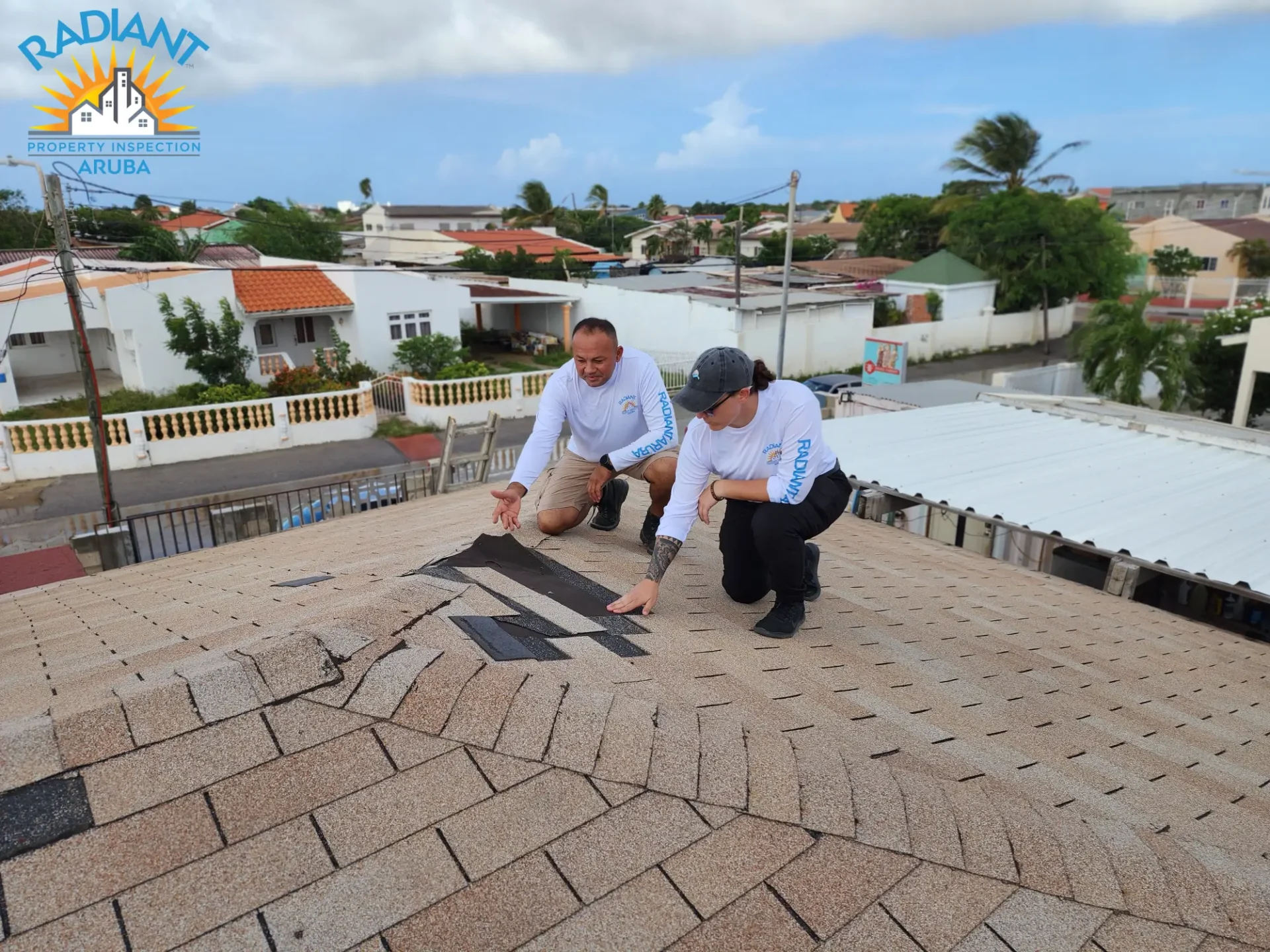 A person inspecting the roof of a house